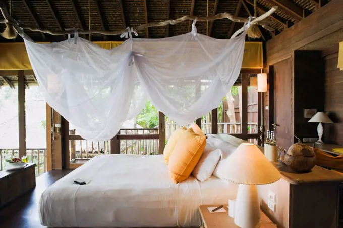 Bed in a luxury bungalow, luxury hotel, Six Senses Resort, Koh Yao Noi island, Phang Nga, Thailand, Southeast Asia, Asia