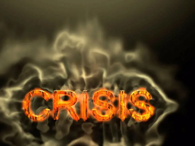 The word crisis burning with flames and smoke