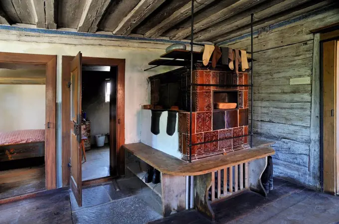 Living room with a tiled stove in a farmhouse, built 1711, Franconian Open Air Museum, Bad Windsheim, Middle Franconia, Bavaria, Germany