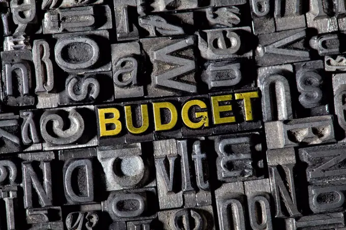 Old lead letters forming the word BUDGET