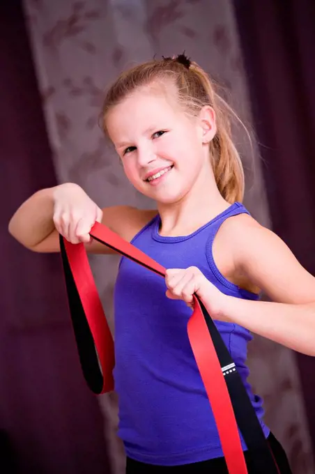Girl, 8, using an exercise band