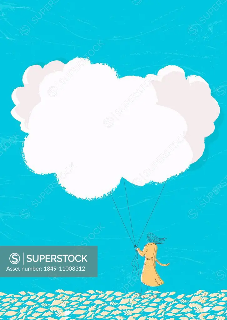 Woman holding cloud balloons on string