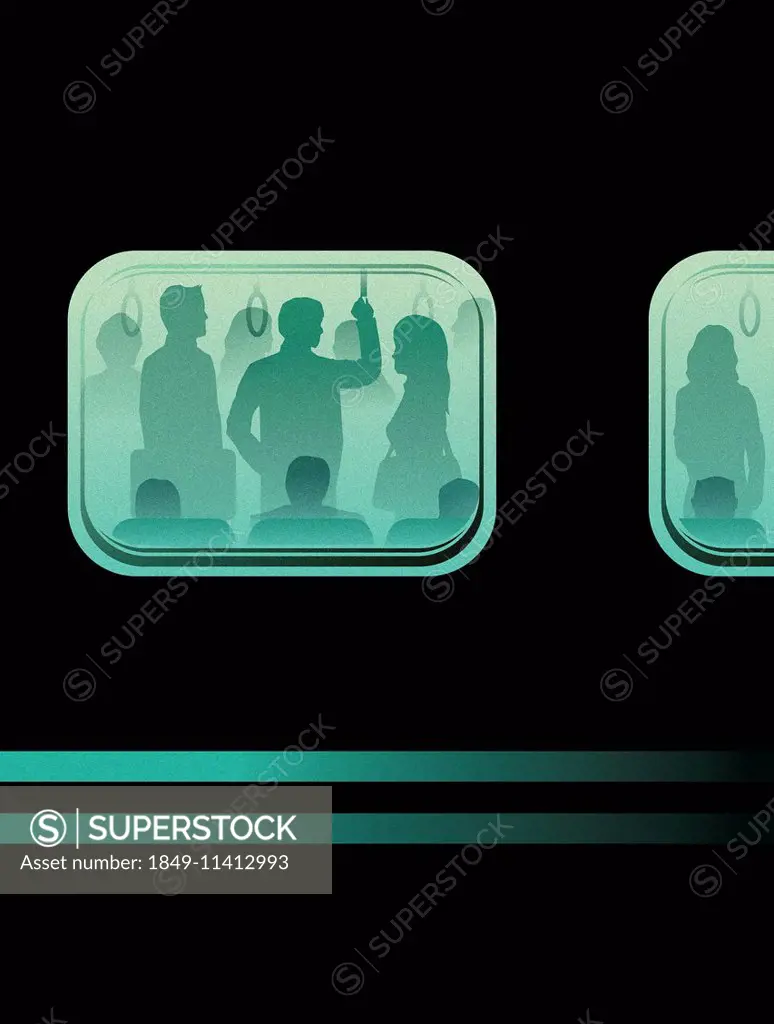 Commuters through window of crowded train in rush hour