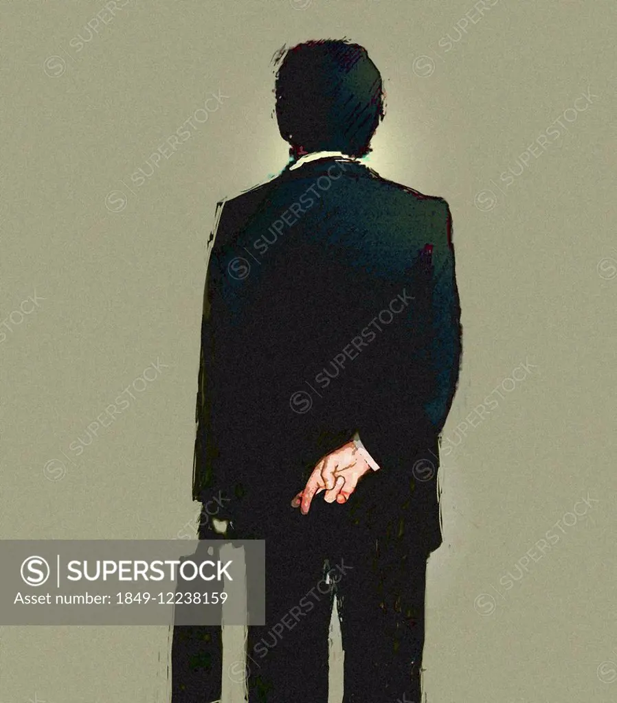 Rear view of businessman with fingers crossed