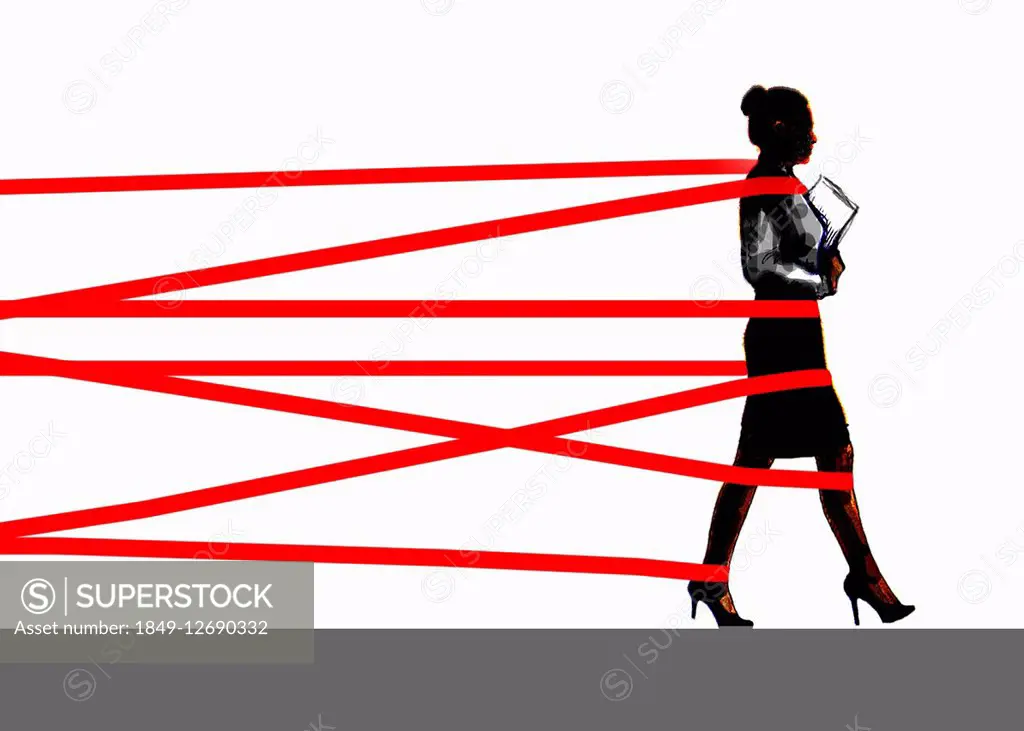 Businesswoman being held back by red tape