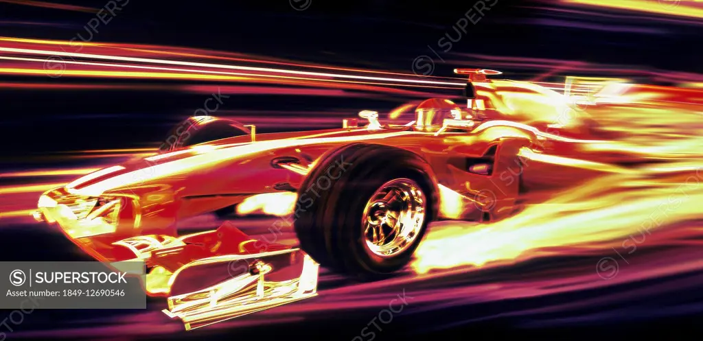 Formula one racing car moving at speed at night