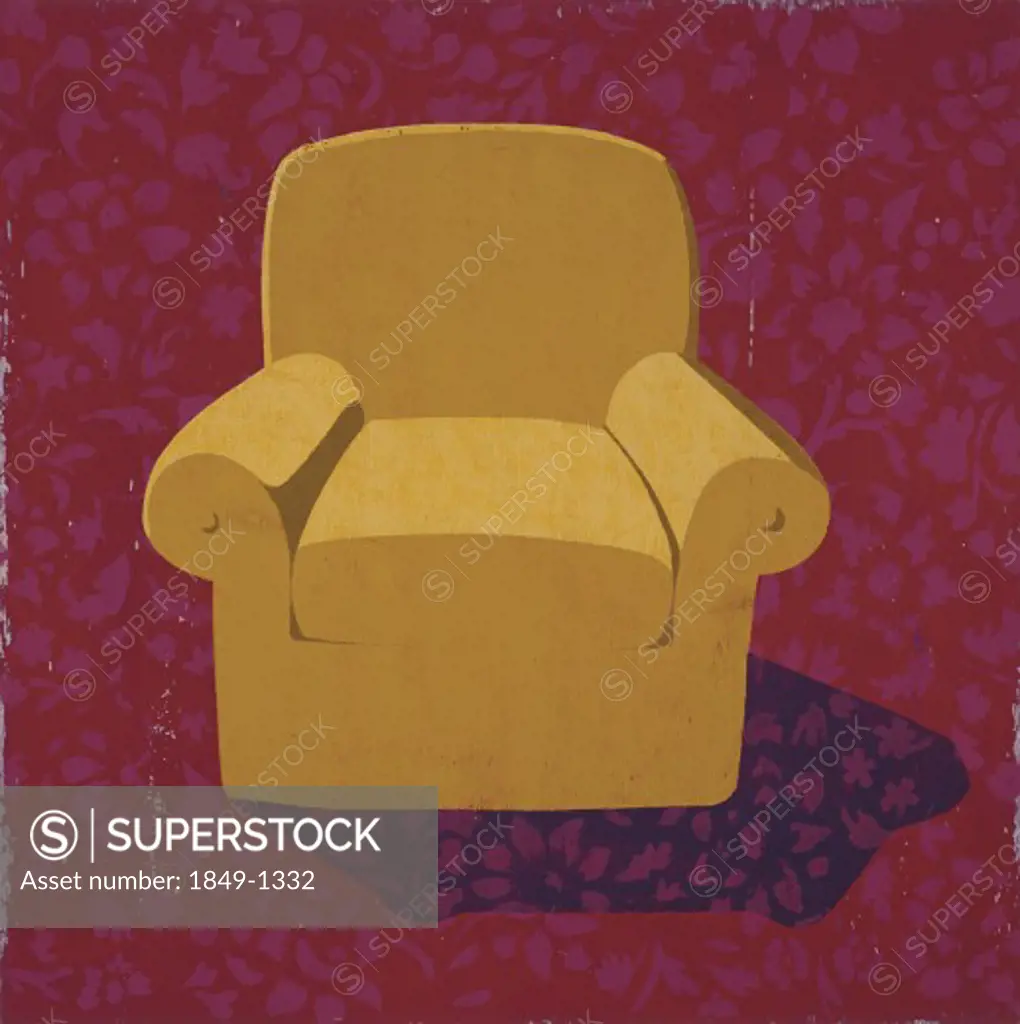 Armchair against patterned wall paper