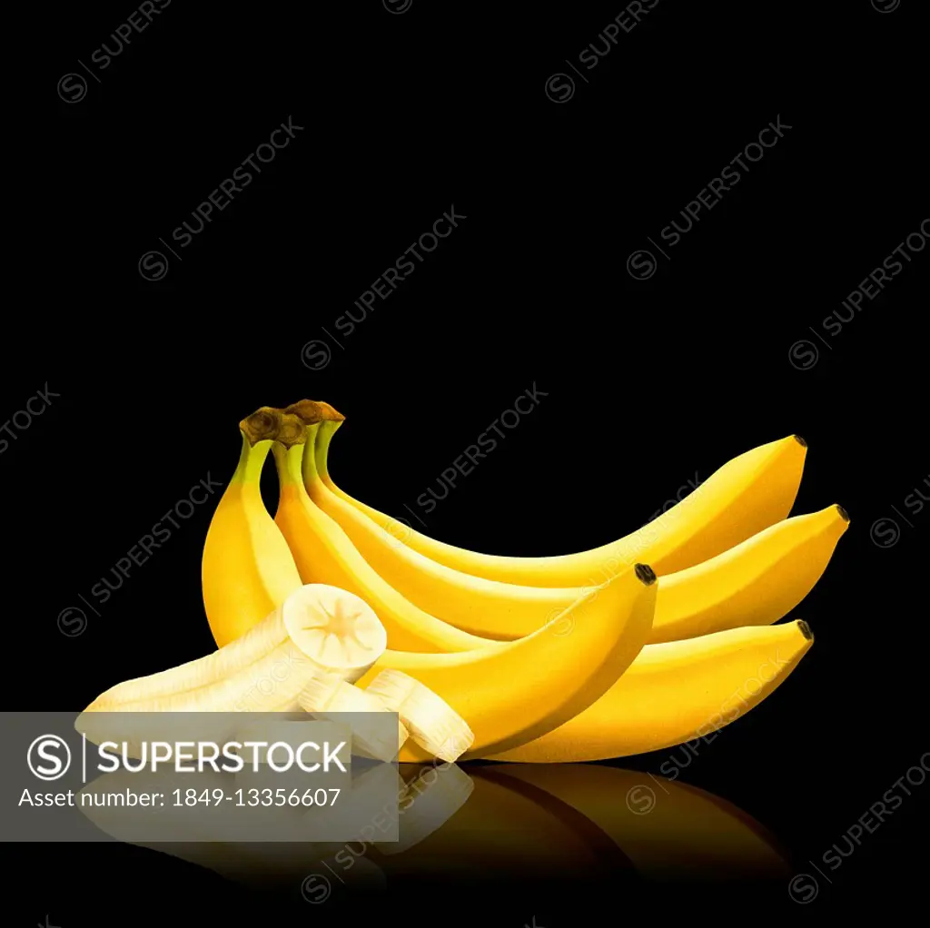 Bunch of bananas and slices of peeled banana