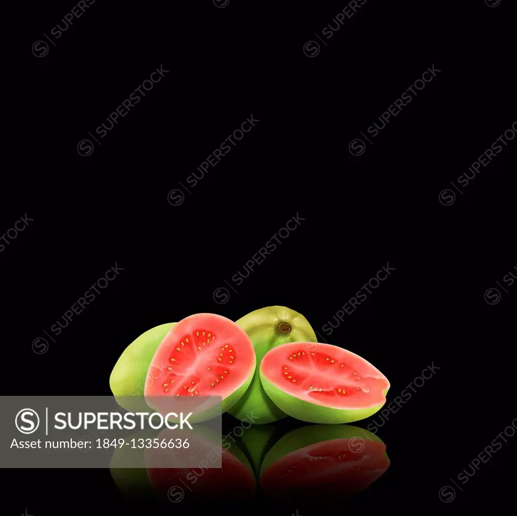 Whole and cut guavas