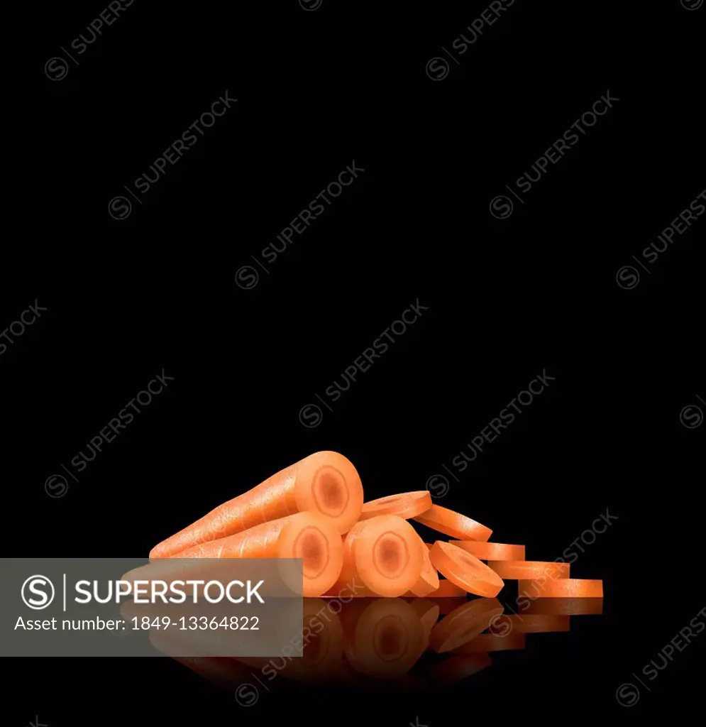 Whole and sliced carrots