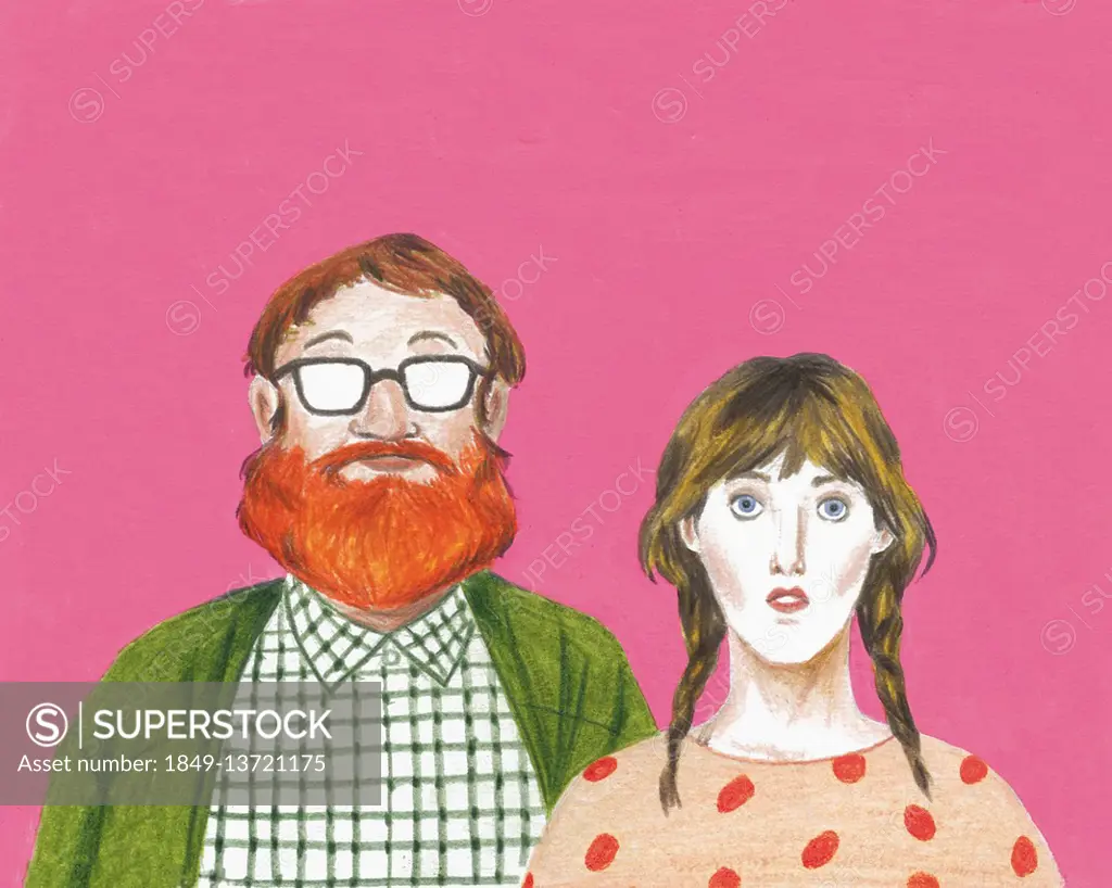 Portrait of geeky couple looking at camera