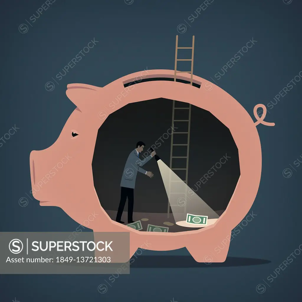 Man searching for money inside of piggy bank