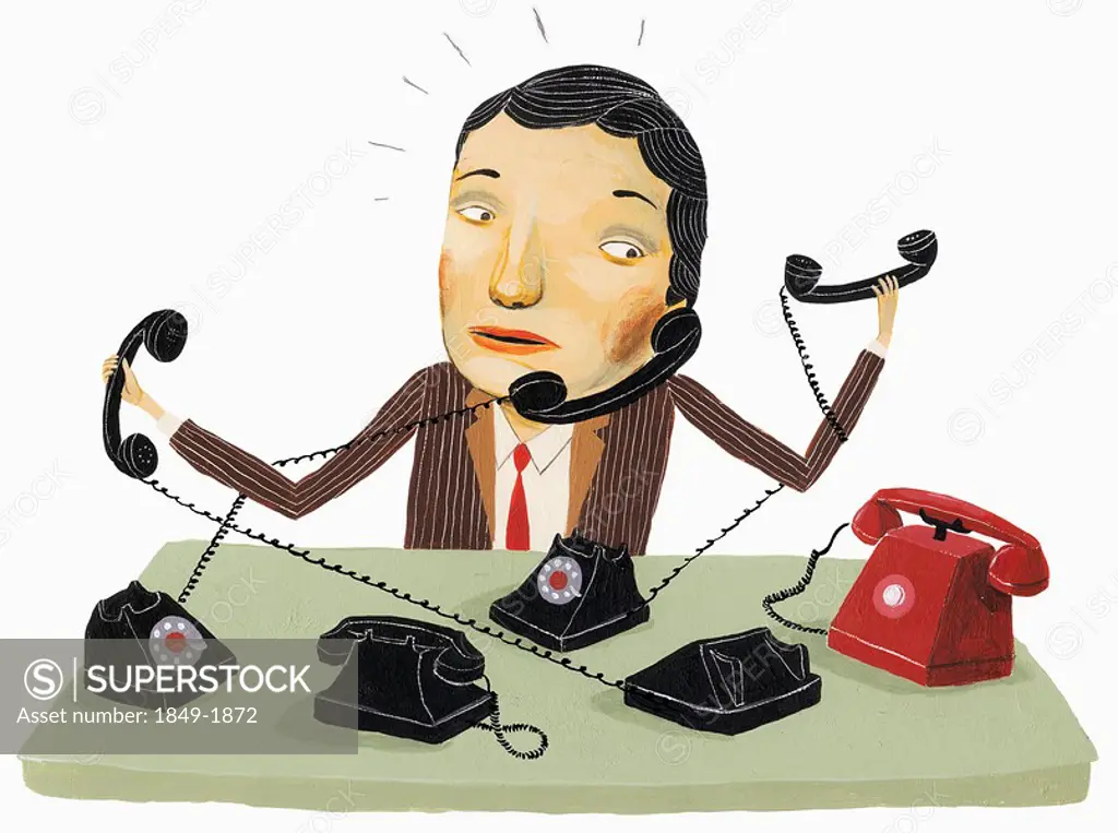 Businessman trying to answer multiple phones