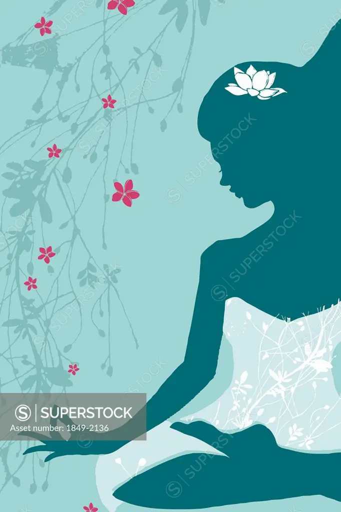Woman sitting in lotus pose with floral design
