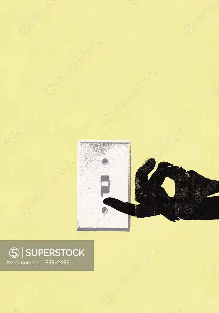 Hand turning on light switch