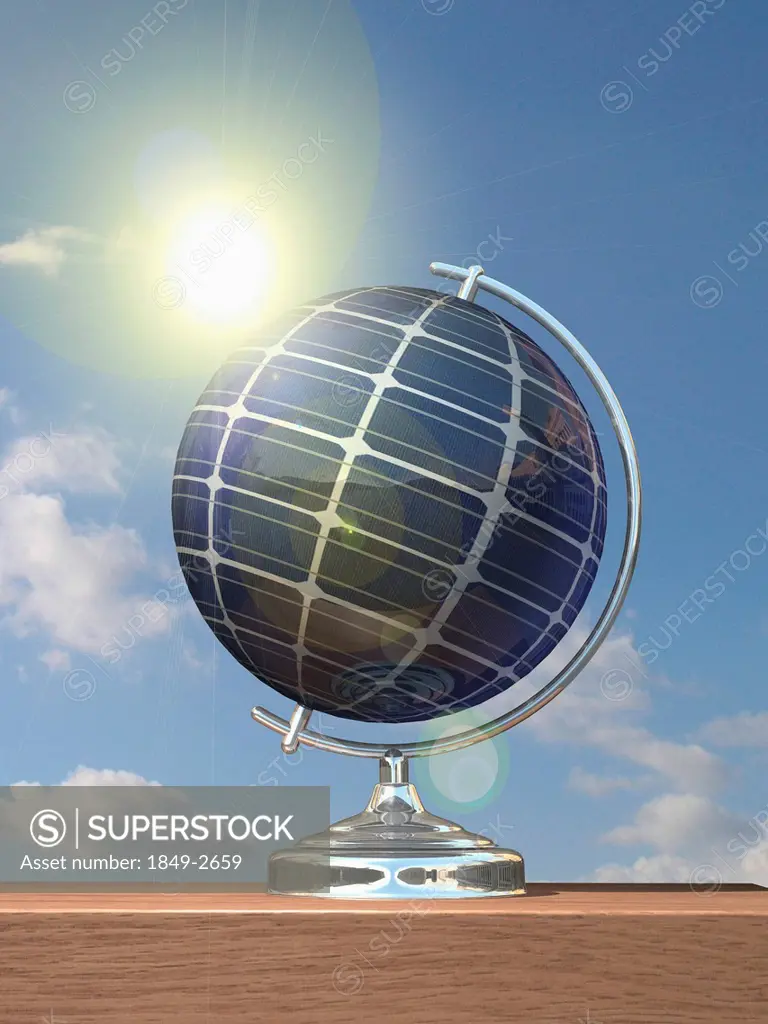 Sun shining on globe covered in solar panels