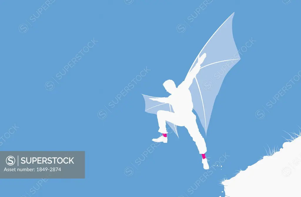 Man with wings jumping from cliff