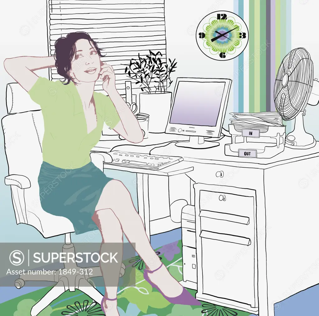 Woman talking on cell phone in home office