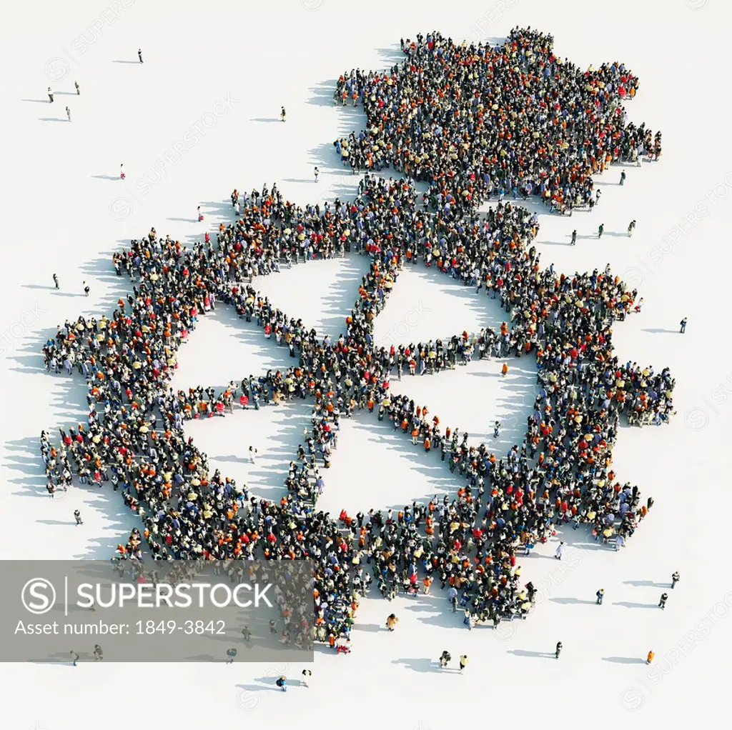 Aerial view of crowd of people arranged in cogs