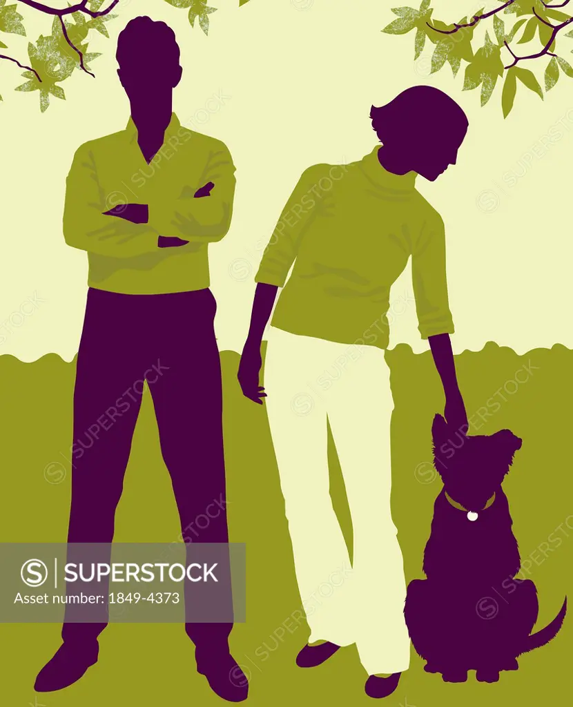 Man with arms crossed next to woman petting dog