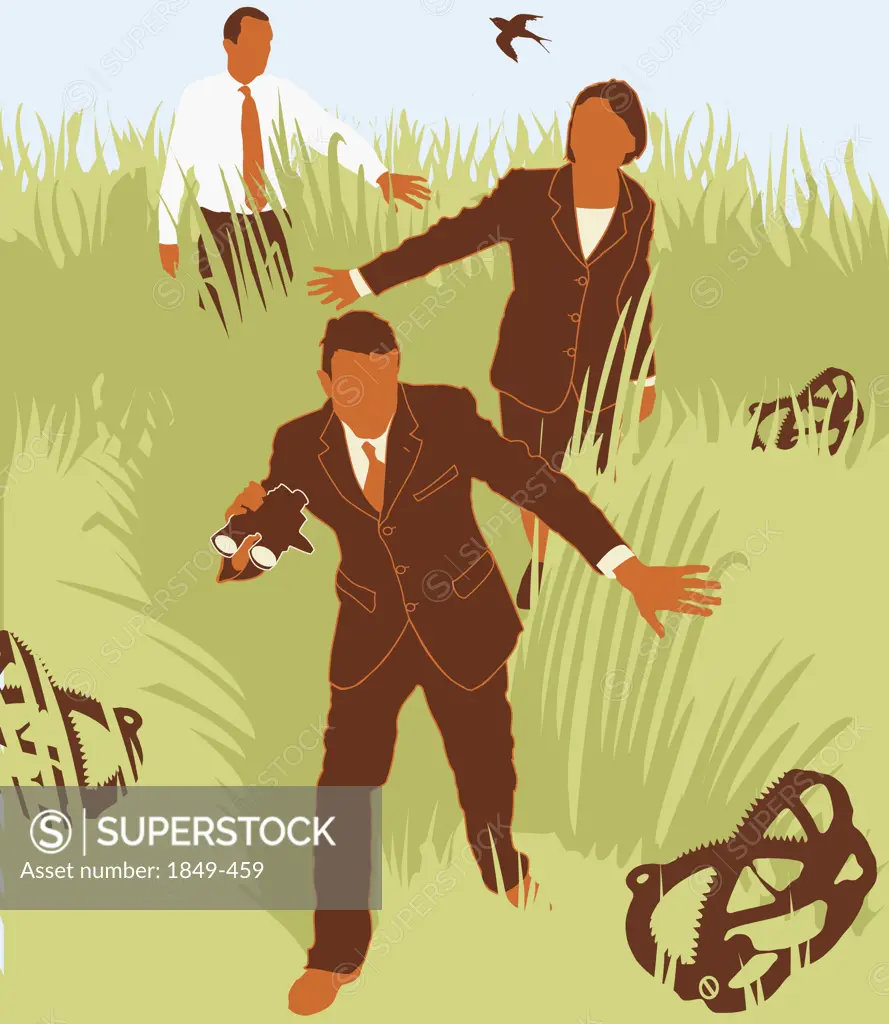 Businesspeople avoiding traps in grass