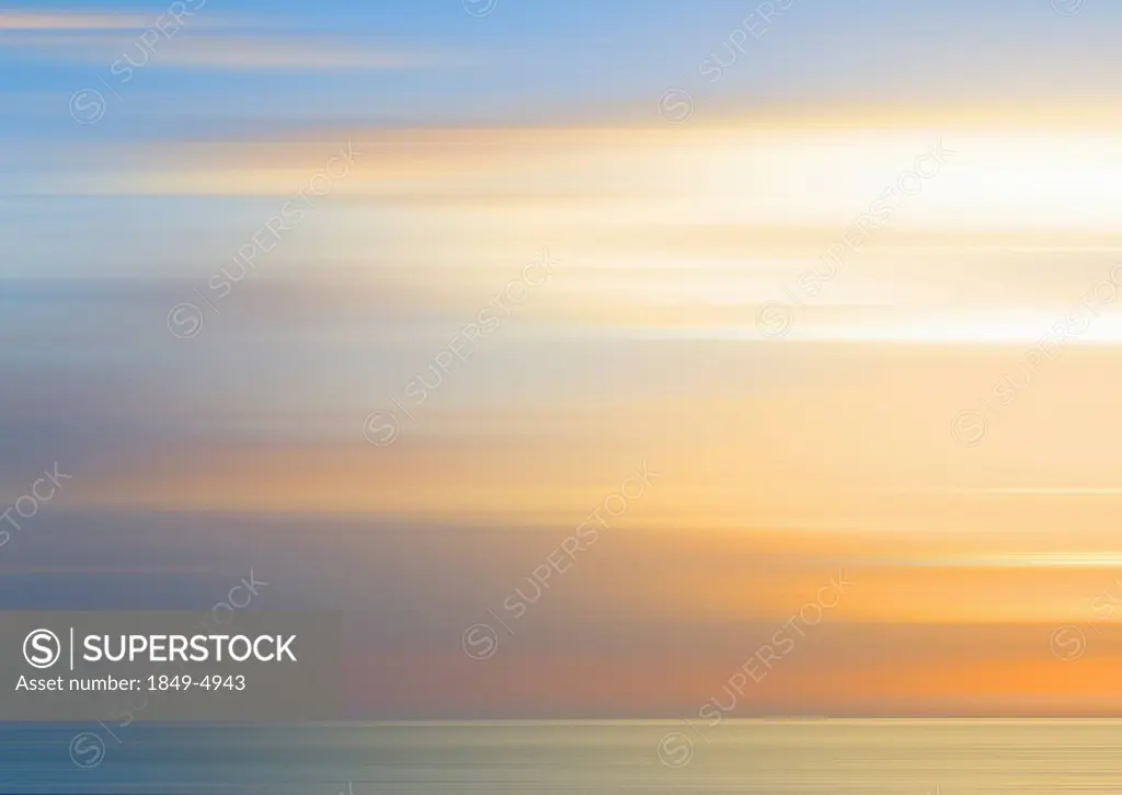 Defocused view of sunset over ocean