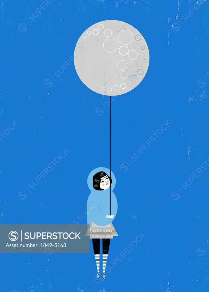 Girl holding full moon balloon