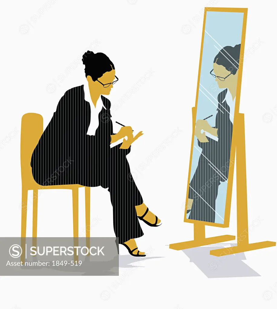 Businesswoman looking in mirror