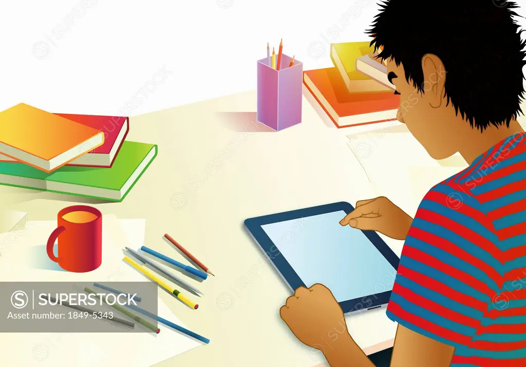 Teenage boy using digital tablet for homework