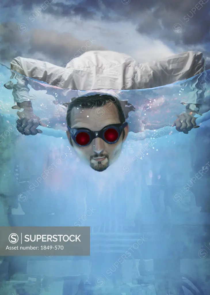 Man in goggles searching underwater