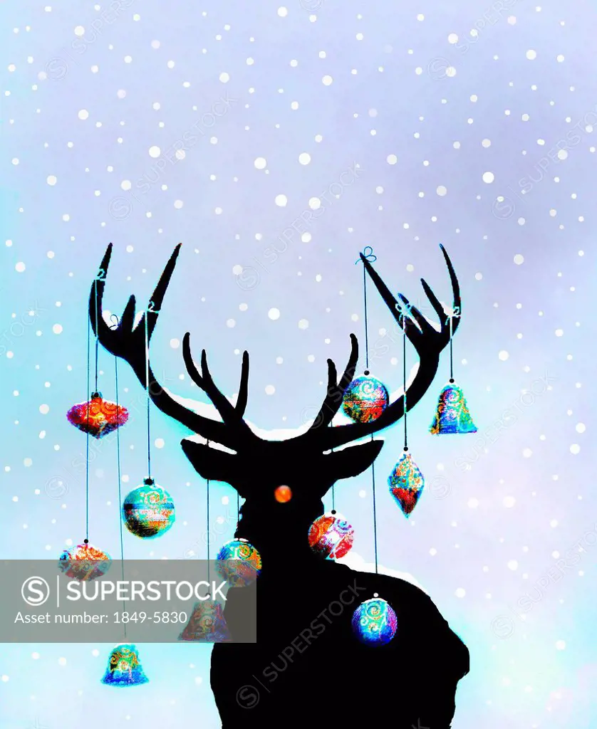 Christmas ornaments hanging from antlers of reindeer