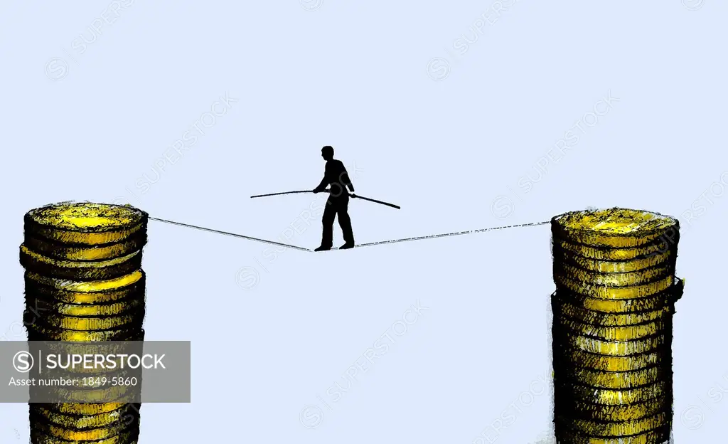 Businessman walking on tightrope supported by stacks of coins