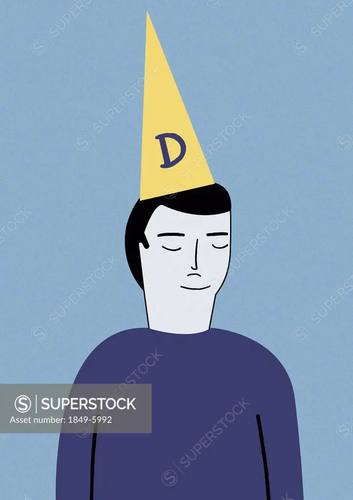 Man wearing dunce cap