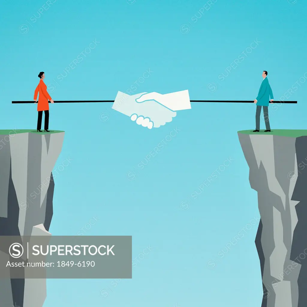 Businessman and businesswoman shaking hands with poles over gap between cliffs