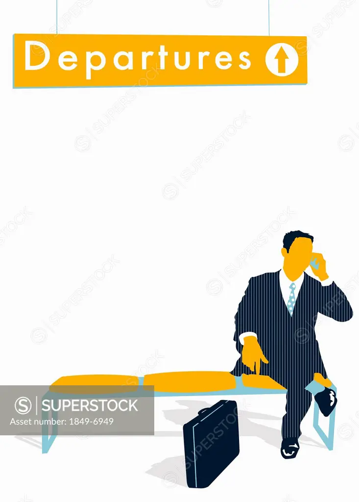 Businessman talking on cell phone below Departures” sign