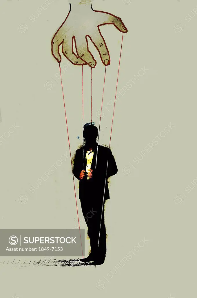 Hand controlling businessman on puppet strings