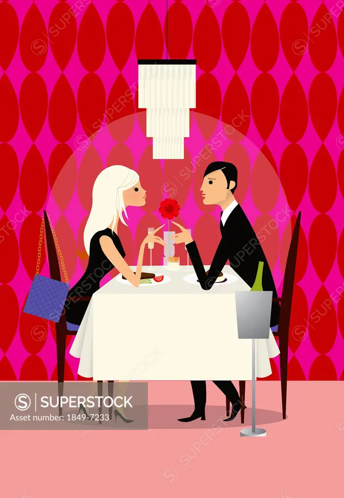 Couple enjoying romantic dinner in restaurant