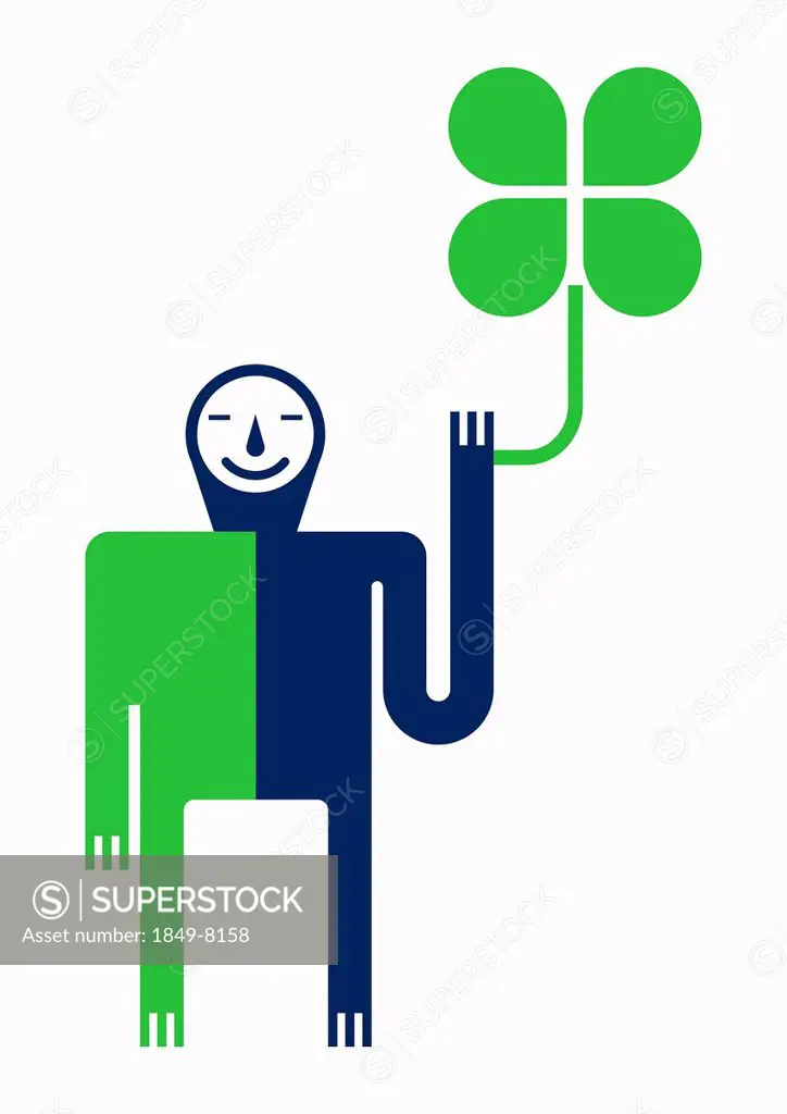 Smiling man holding four leaf clover