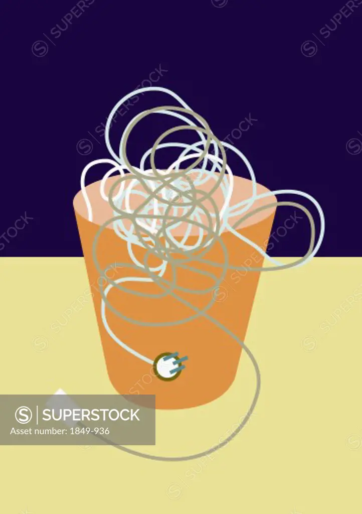 Tangle of old-fashioned plugs and cords in waste basket
