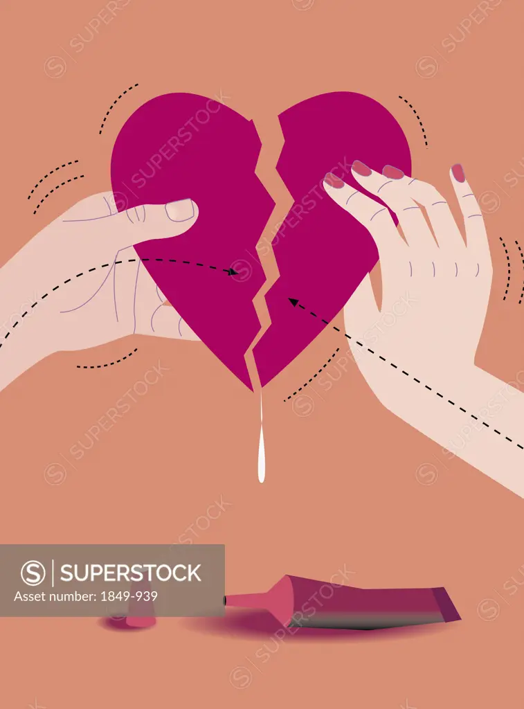 Man and woman gluing torn heart together