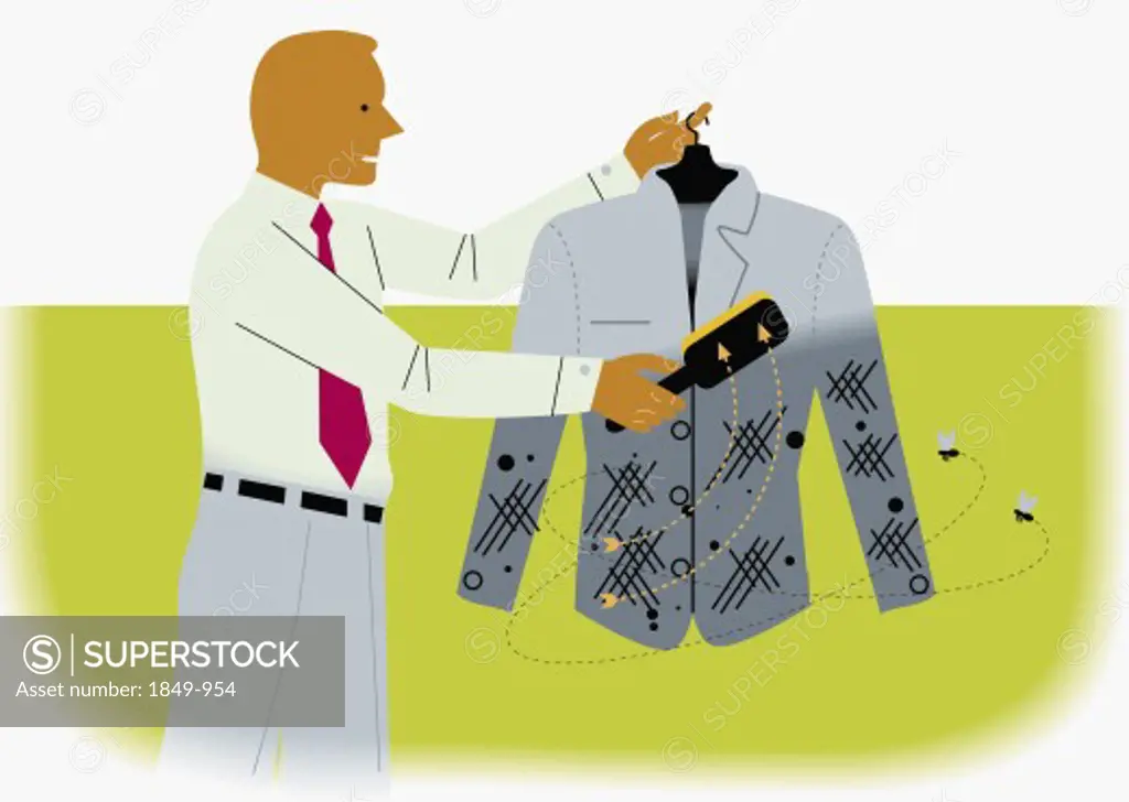 Businessman using lint brush on suit jacket