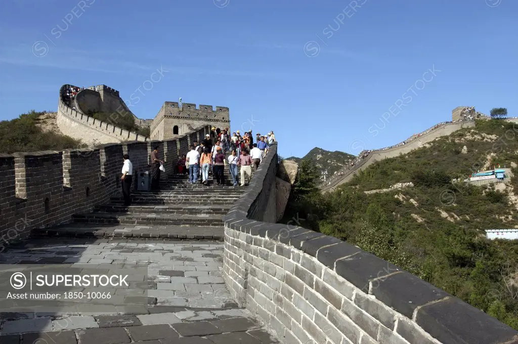 China, Great Wall, View Along A Section Of The Wall With Tourists Walking Down Steps