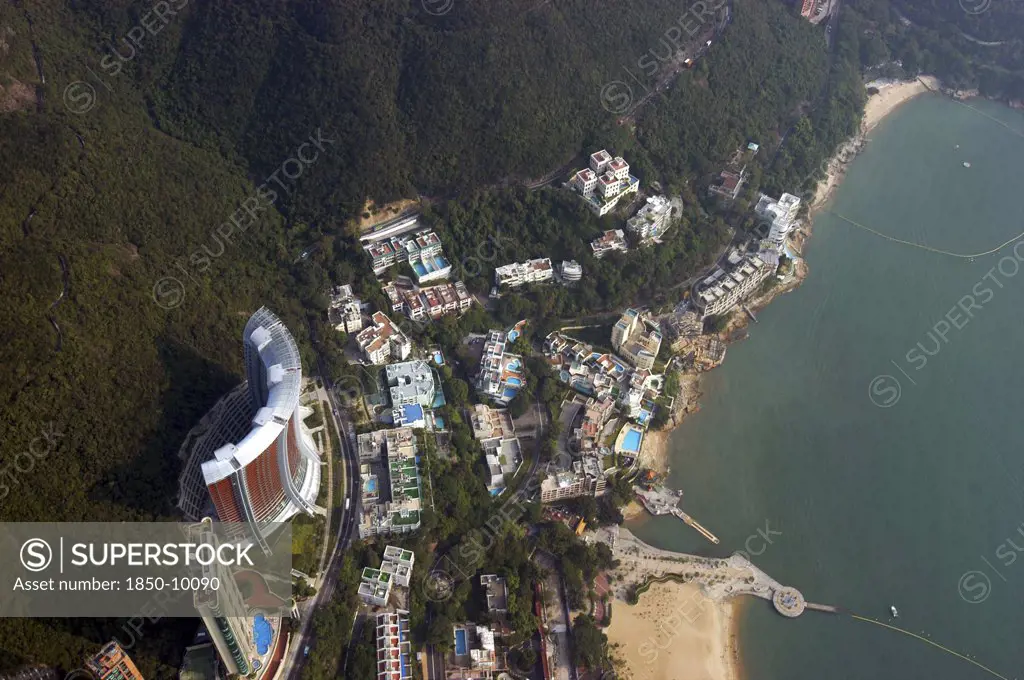 Hong Kong, General, Aerial View Looking Directly Down On Section Of Coastline With Sandy Beach And Hotel Pools