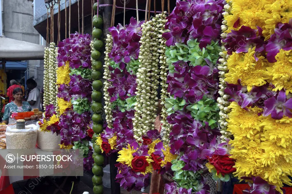 Malaysia, Kuala Lumpur, Row Of Hanging Flower Garlands Ouside An Indian Temple