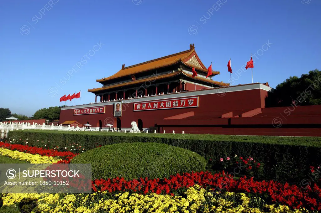China, Beijing, Tiananmen Square, Tiananmen Monument Aka Gate Of Heavenly Peace With Portrait Of Mao On The Front And Flower Beds In The Foreground