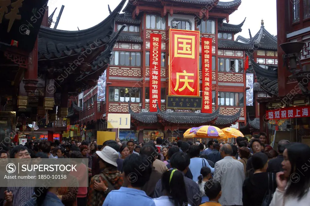 China, Shanghai, Crowded Street Scene With Red And Black Traditional Architecture
