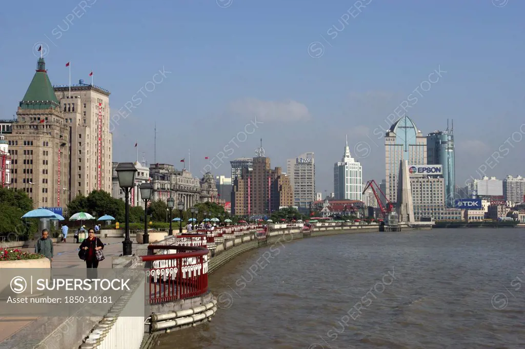 China, Shanghai, The Bund Aka Zhong Shan Road. View Along The Promenade That Runs Along The Huangpu River With The City Skyline In The Distance
