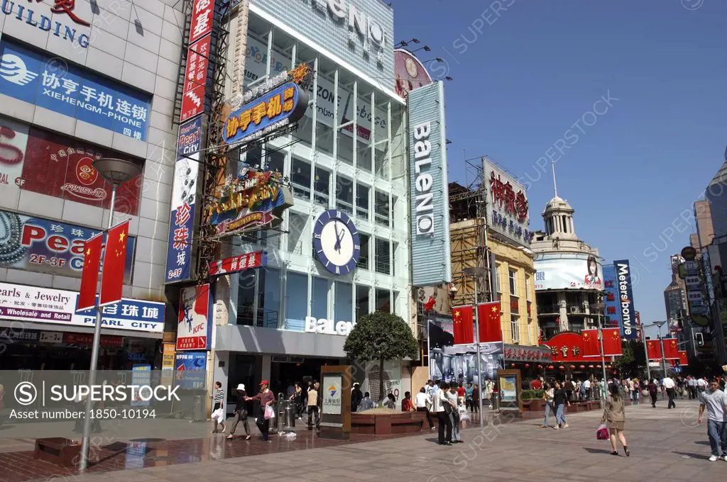 China, Shanghai, Nanjing Road Walking Street. Commercial Shopping Street With Building Facades Covered With Advertising Signs