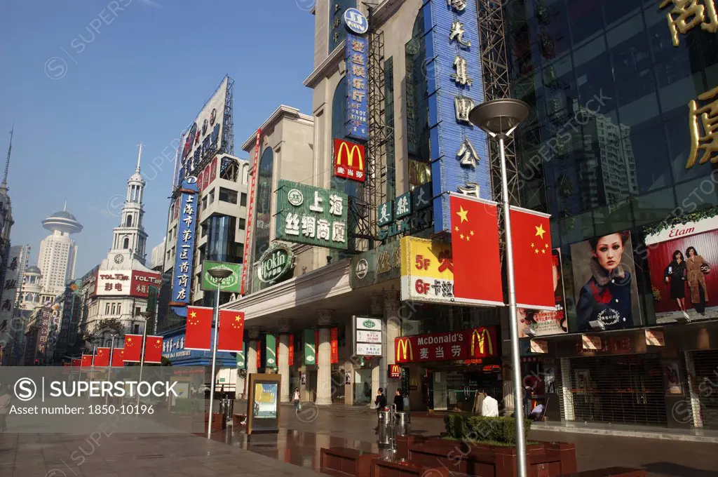 China, Shanghai, Nanjing Road Walking Street. Commercial Shopping Street With Building Facades Covered With A Mass Of Advertising Signs