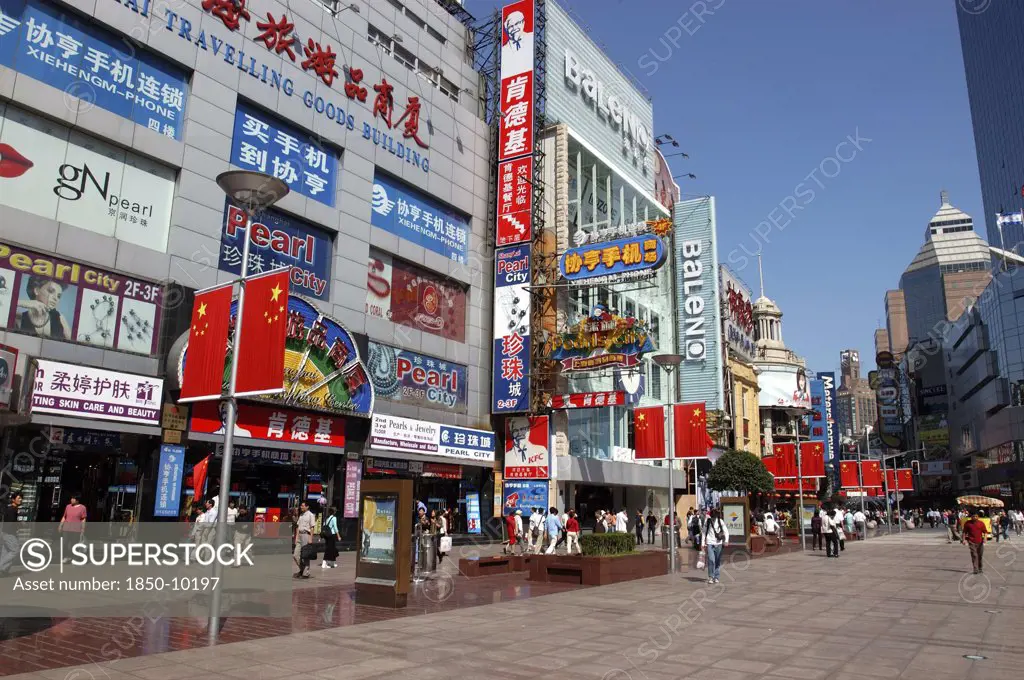 China, Shanghai, Nanjing Road Walking Street. Commercial Shopping Street With Building Facades Covered With A Mass Of Advertising Signs